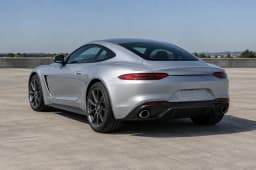 Photo used: Rear three-quarter photo of an unbadged silver sports coupe (AI-generated sample car)